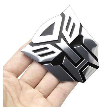 Emblema TRANSFORMERS ALUMINIO M1