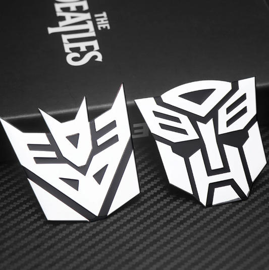 Emblema TRANSFORMERS ALUMINIO M1