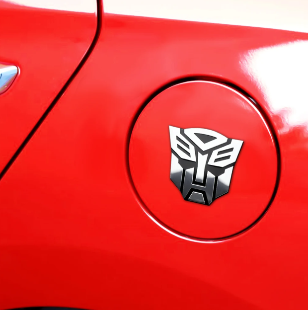 Emblema TRANSFORMERS ALUMINIO M1