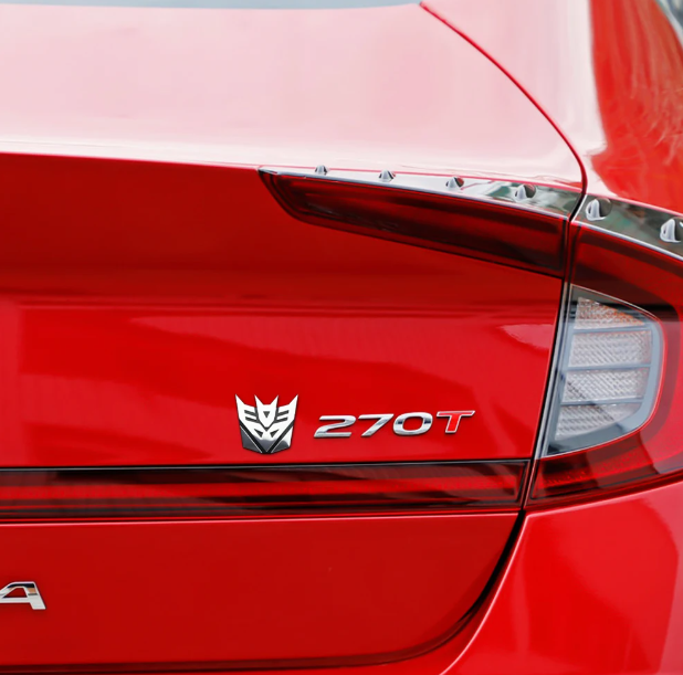 Emblema TRANSFORMERS ALUMINIO M1