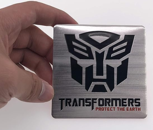 Emblema TRANSFORMERS ALUMINIO M2